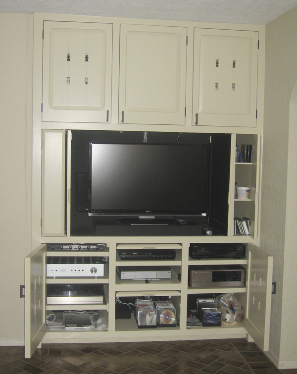 Kyle entertainment center Installed with doors open showing components and media storage