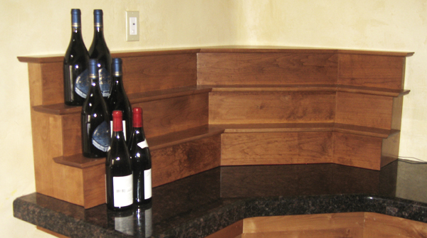 Stage for placing wine and licquor bottles on bar